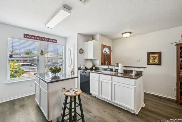 a kitchen with stainless steel appliances granite countertop a stove and a sink