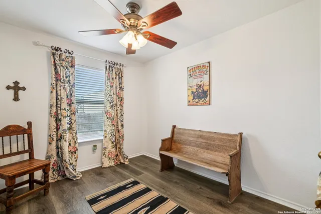 a view of room with stairs and wooden floor