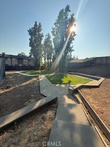 a view of a yard with swimming pool