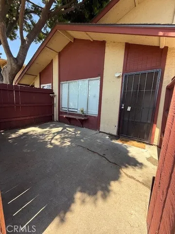 a view of backyard with a large tree