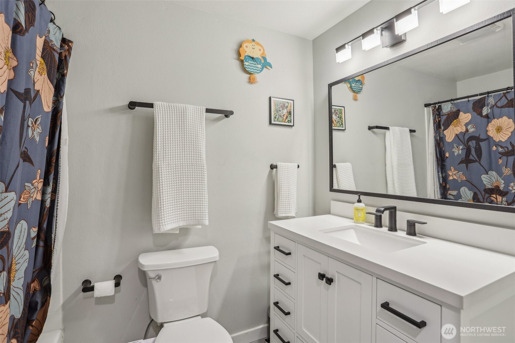 2711 164th Place Southeast Bothell, WA 98012 - Photo 16 of 26 a bathroom with a sink vanity mirror and toilet