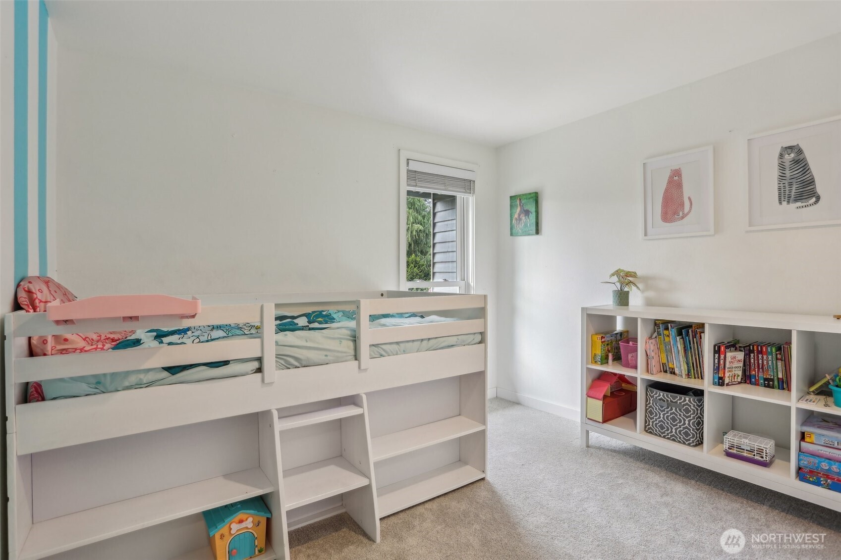 2711 164th Place Southeast Bothell, WA 98012 - Photo 17 of 26 a room with a bed and a book shelf