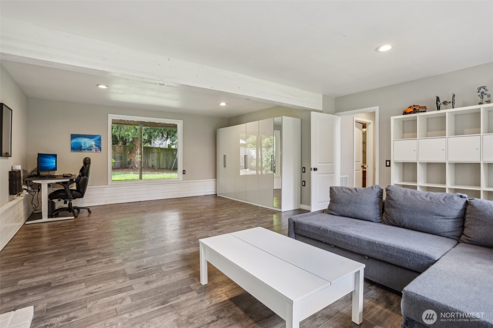 2711 164th Place Southeast Bothell, WA 98012 - Photo 20 of 26 a living room with furniture and a wooden floor