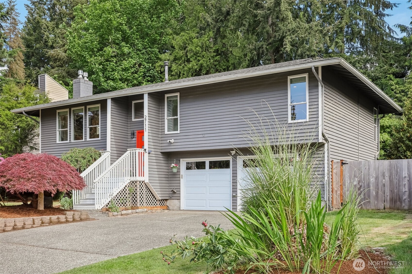 2711 164th Place Southeast Bothell, WA 98012 - Photo 25 of 26 a front view of a house with garden