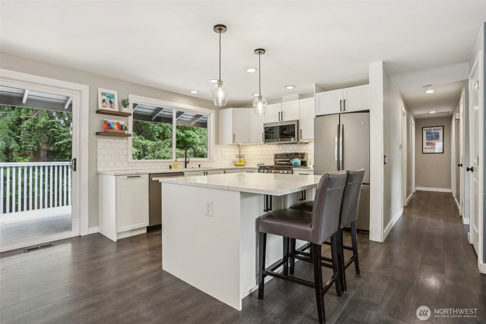 2711 164th Place Southeast Bothell, WA 98012 - Photo 7 of 26 a kitchen with a table chairs refrigerator and cabinets