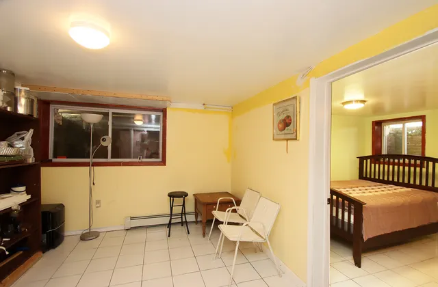 a bedroom with a bed and chair