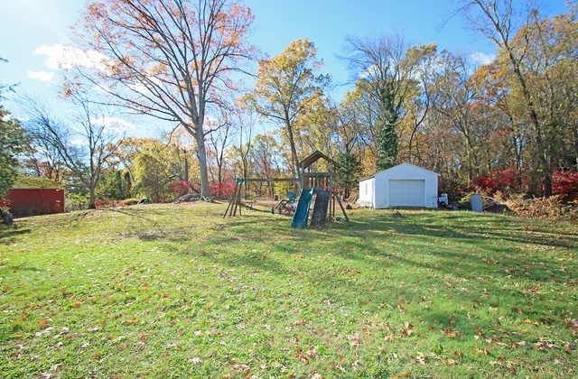 a view of outdoor space with deck and trees