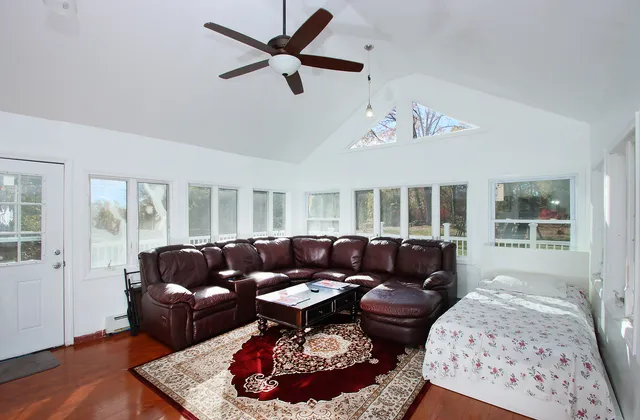 a living room with furniture and a window