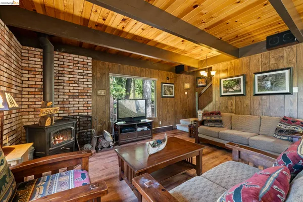 a outdoor living space with furniture and a flat screen tv