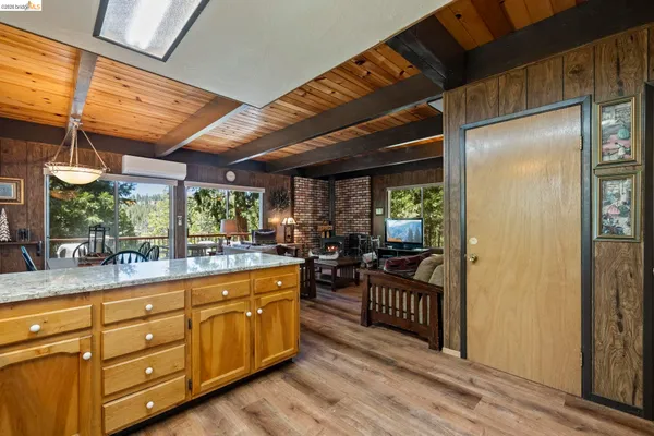 a kitchen with sink cabinets and stove