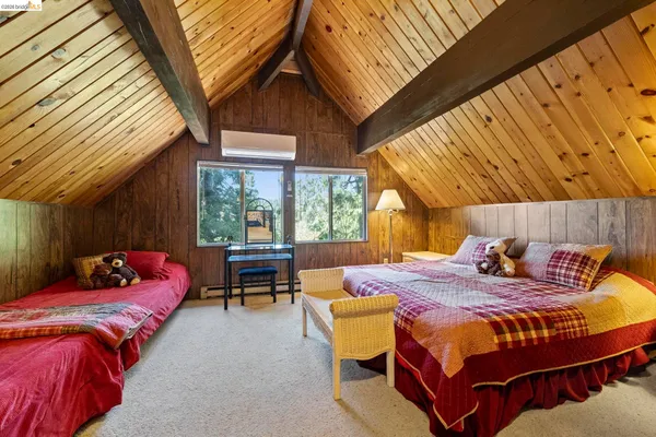 a outdoor space with a bed couch and table