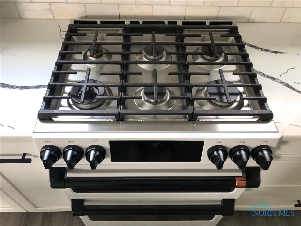 9414 Sheffield Road Perrysburg, OH 43551 - Photo 14 of 34 Fabulous upgraded kitchen appliances, this 6 burner gas range is just one of many. Chef's will LOVE this space.