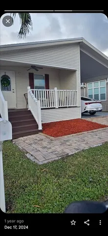 a view of front door of house with yard