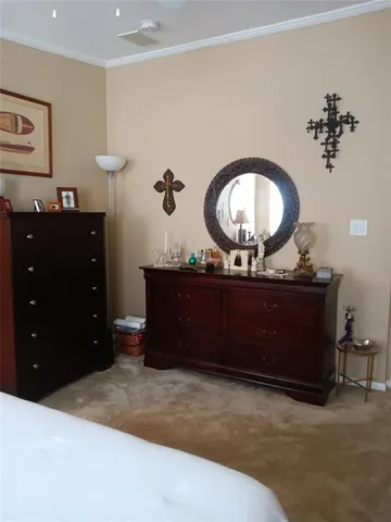 a bedroom with a bed furniture and window