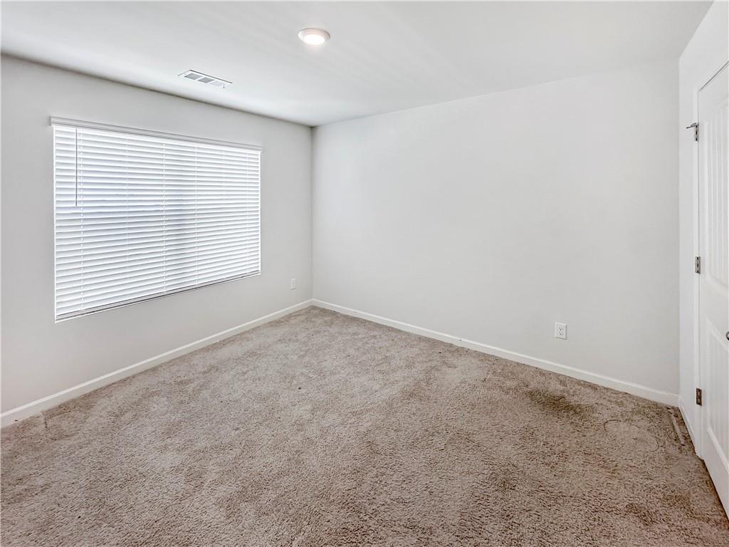 965 Athena Bend Fairburn, GA 30213 - Photo 11 of 37 an empty room with a window