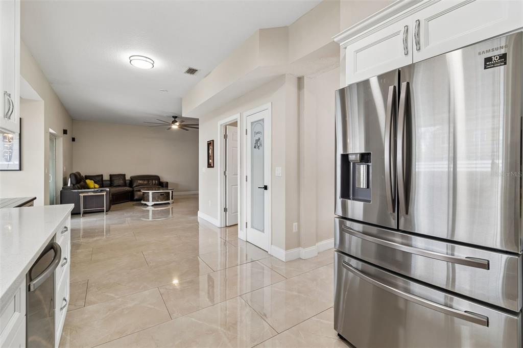 2829 Pankaw Lane Valrico, FL 33596 - Photo 14 of 55 a kitchen with stainless steel appliances a refrigerator and cabinets