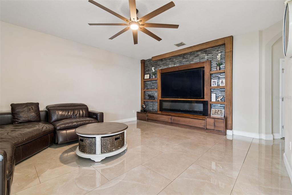 2829 Pankaw Lane Valrico, FL 33596 - Photo 20 of 55 a living room with furniture and a flat screen tv