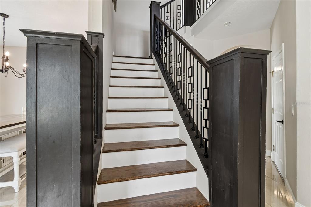 2829 Pankaw Lane Valrico, FL 33596 - Photo 26 of 55 a view of staircase with wooden floor and white walls