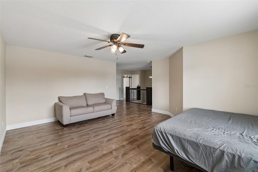 2829 Pankaw Lane Valrico, FL 33596 - Photo 28 of 55 a living room with furniture and a wooden floor