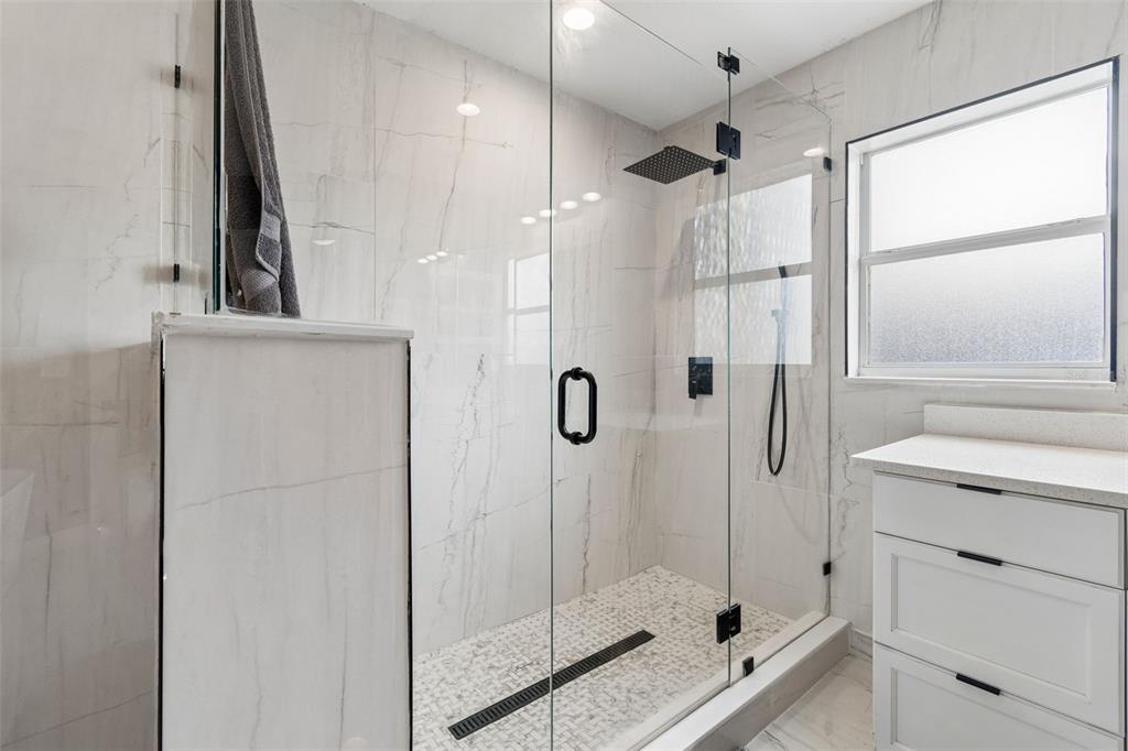 2829 Pankaw Lane Valrico, FL 33596 - Photo 35 of 55 a bathroom with a shower and a sink