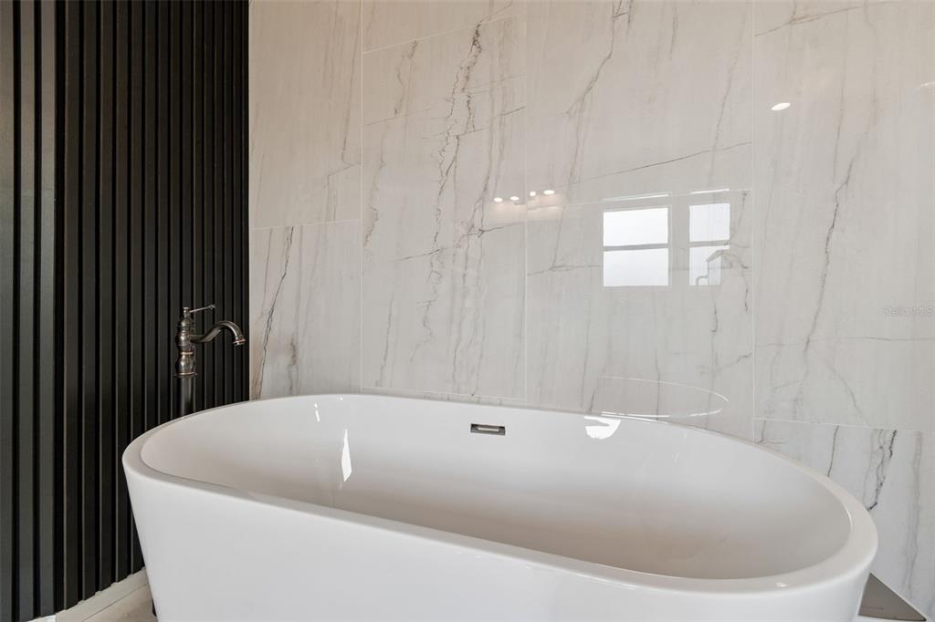 2829 Pankaw Lane Valrico, FL 33596 - Photo 37 of 55 a bathroom with a bathtub