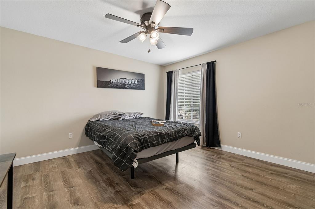 2829 Pankaw Lane Valrico, FL 33596 - Photo 39 of 55 a bedroom with a bed and a table in it
