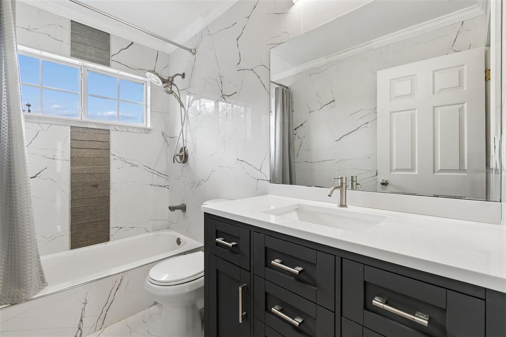 2829 Pankaw Lane Valrico, FL 33596 - Photo 41 of 55 a bathroom with a sink a toilet and shower