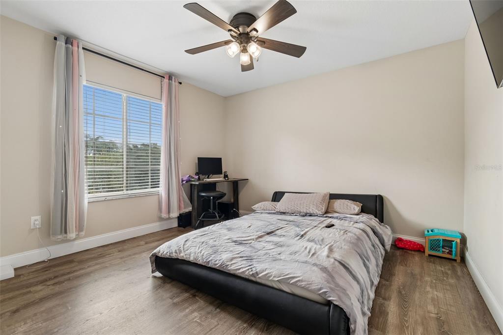 2829 Pankaw Lane Valrico, FL 33596 - Photo 46 of 55 a bedroom with a bed and a large window