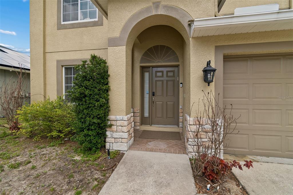 2829 Pankaw Lane Valrico, FL 33596 - Photo 5 of 55 a front view of a house with a garden