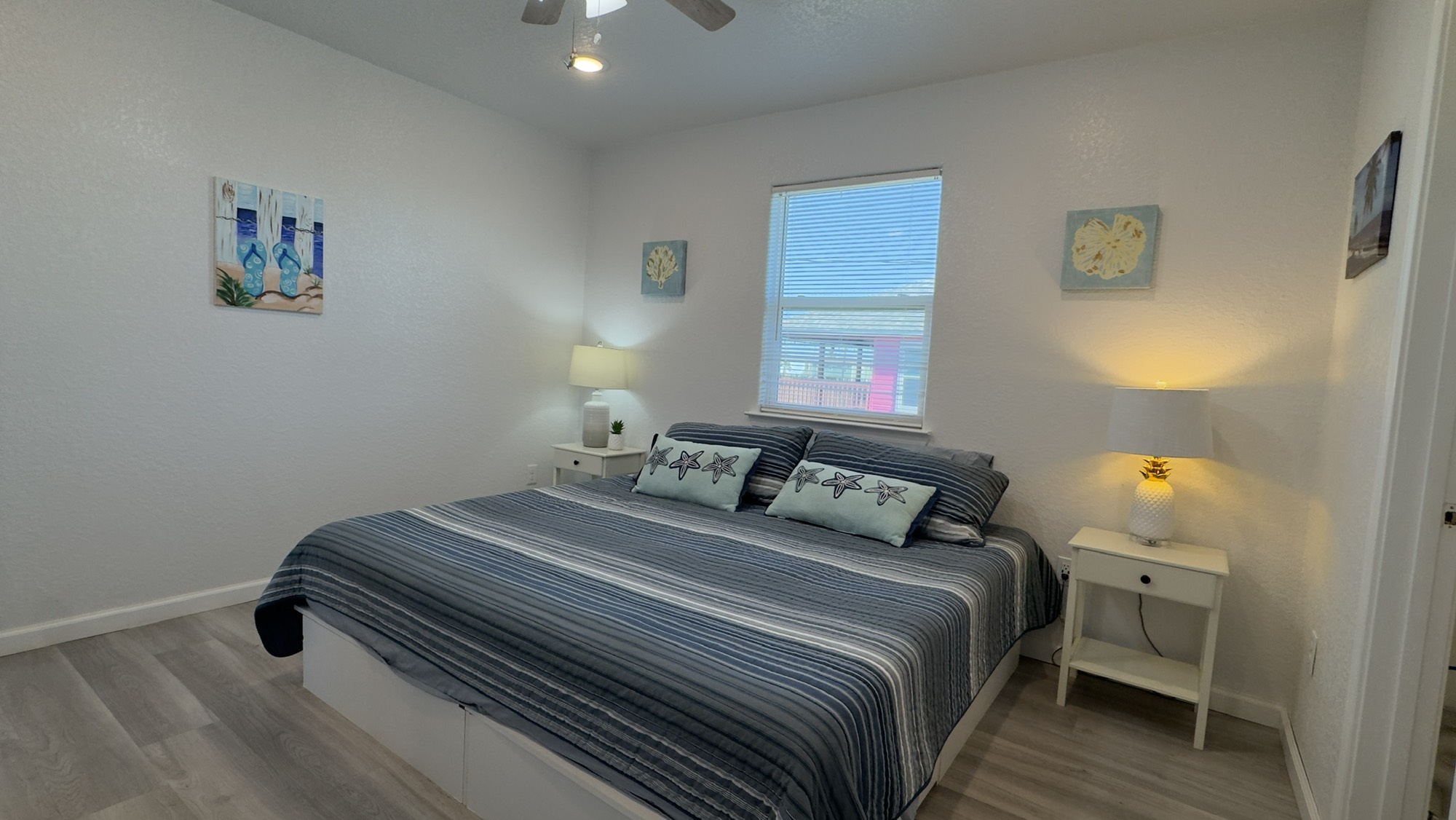 317 Olive Street Surfside Beach, TX 77541 - Photo 11 of 22 a bedroom with a bed and a window