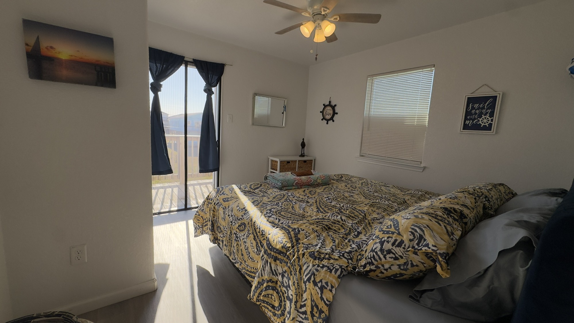 317 Olive Street Surfside Beach, TX 77541 - Photo 13 of 22 a bedroom with a bed and a flat screen tv