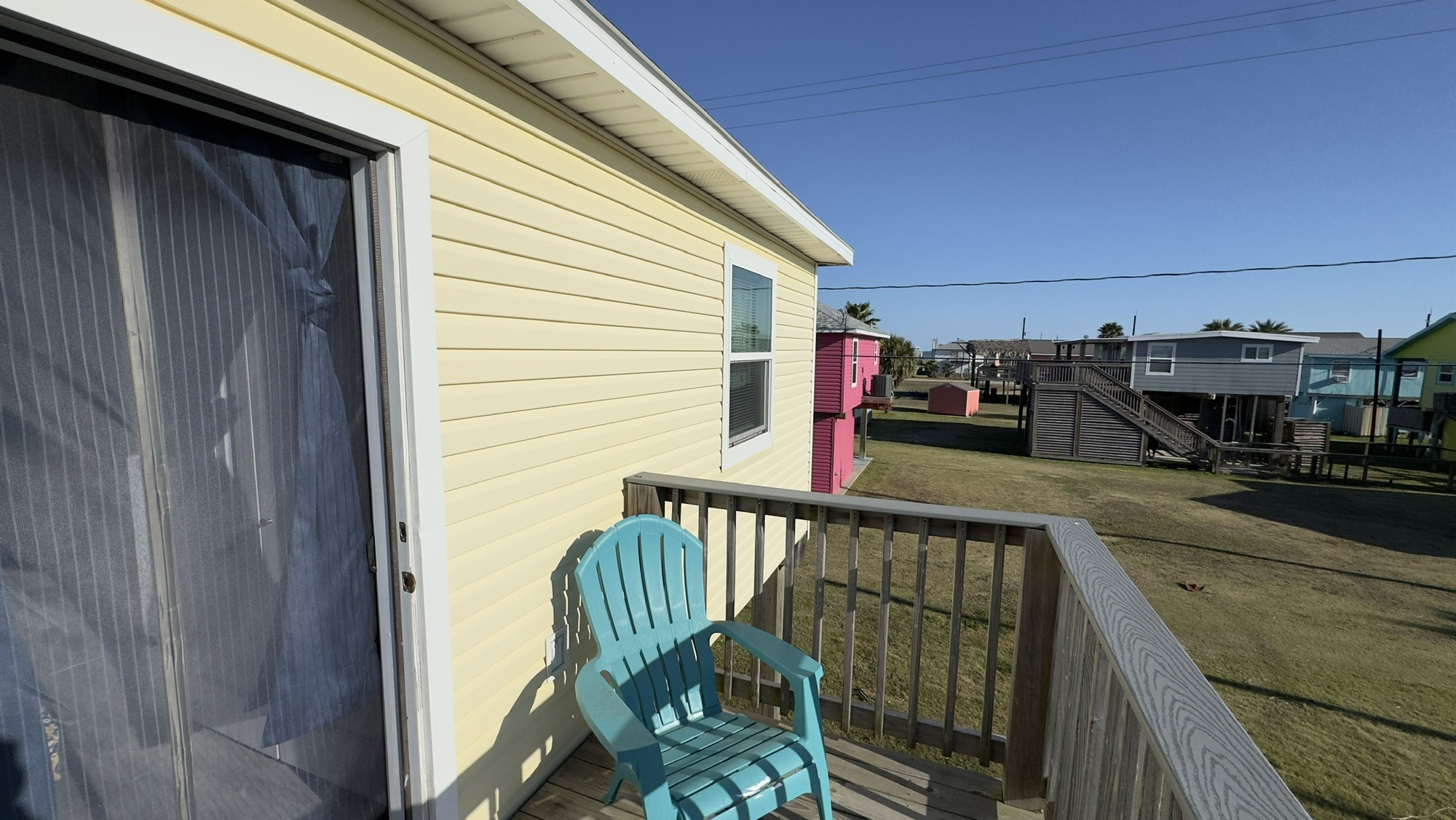 317 Olive Street Surfside Beach, TX 77541 - Photo 14 of 22 a view of a balcony with car parked