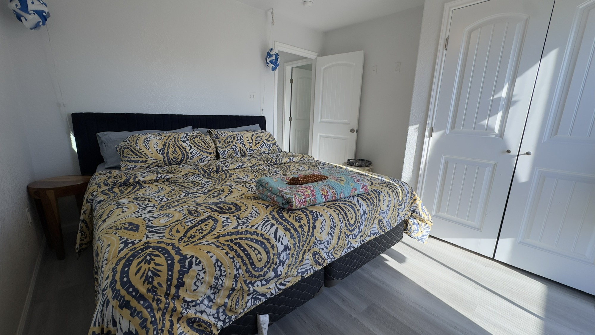 317 Olive Street Surfside Beach, TX 77541 - Photo 15 of 22 a bedroom with a bed and a mirror