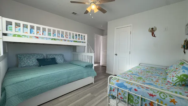 a bedroom with bed and a window