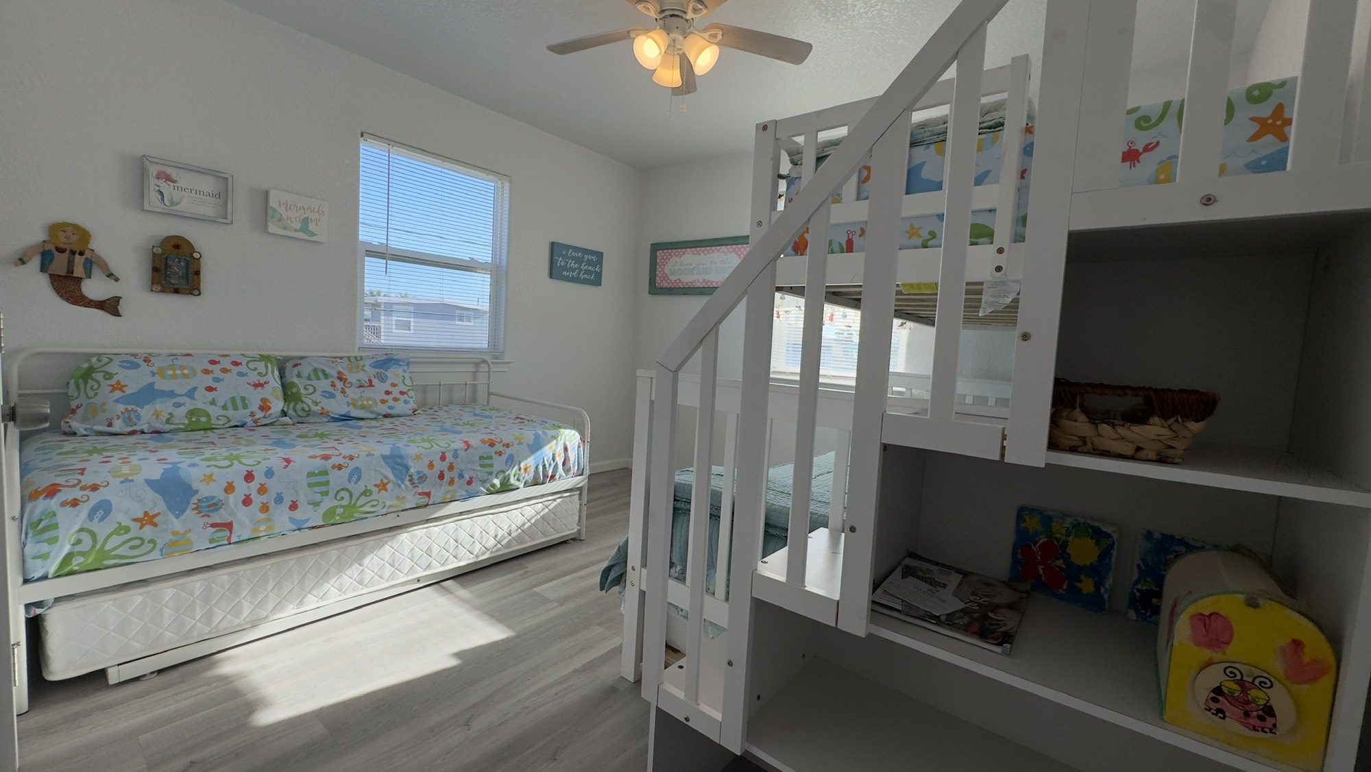 317 Olive Street Surfside Beach, TX 77541 - Photo 17 of 22 a bedroom with bed and a window