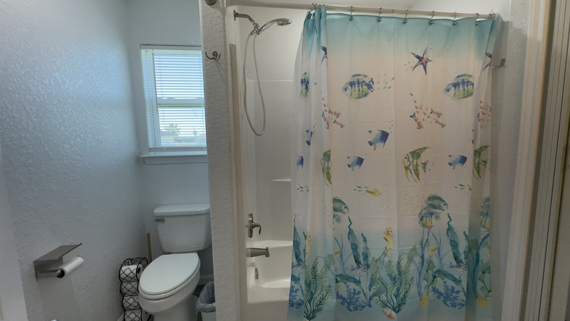 317 Olive Street Surfside Beach, TX 77541 - Photo 18 of 22 a bathroom with a shower and a toilet