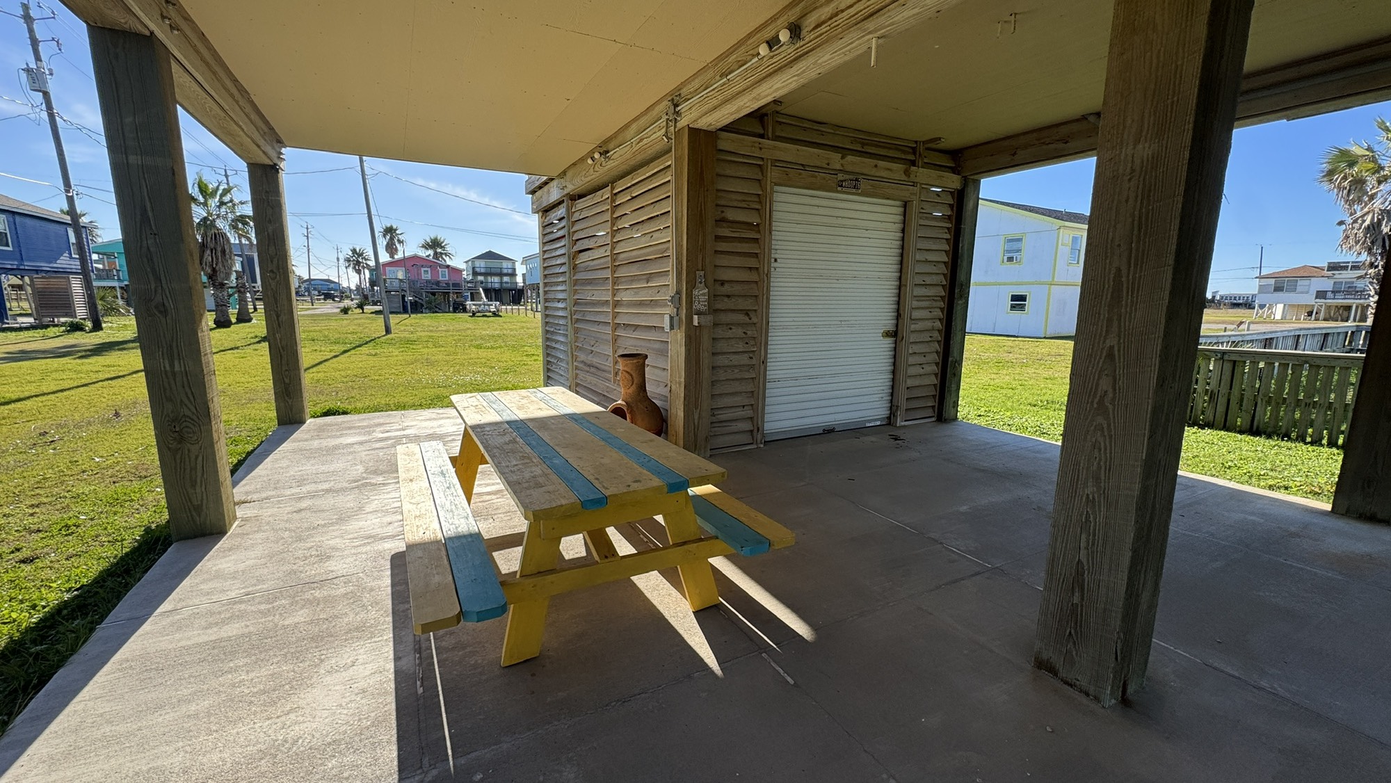317 Olive Street Surfside Beach, TX 77541 - Photo 21 of 22 a view of a porch with wooden floor