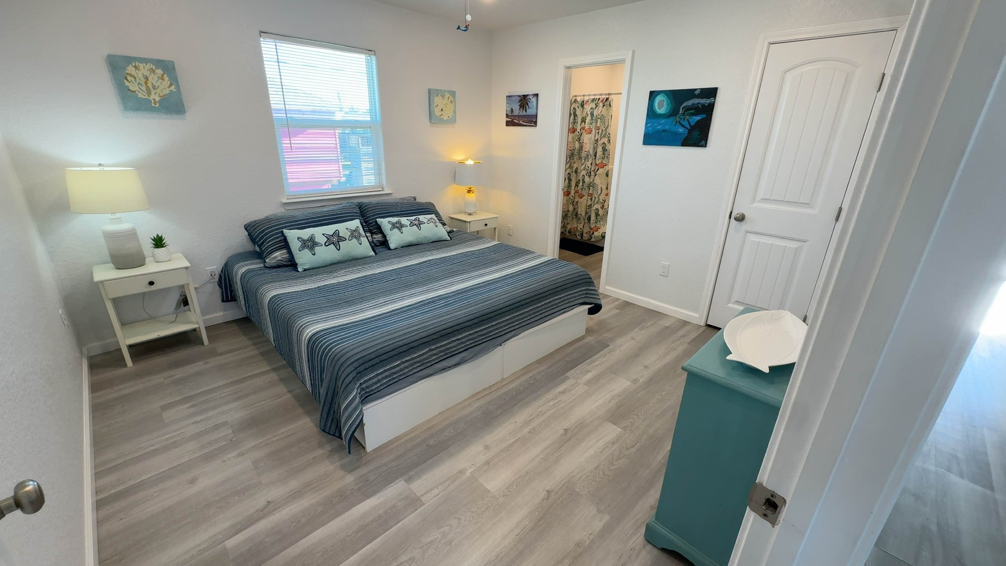 317 Olive Street Surfside Beach, TX 77541 - Photo 10 of 22 a bedroom with a bed and a window