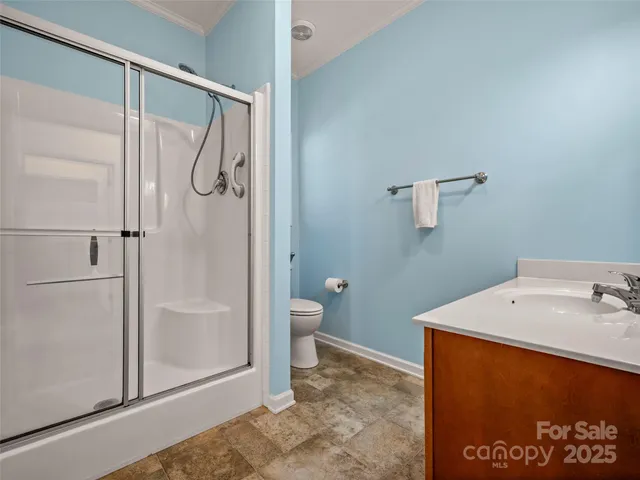 a bathroom with a shower and toilet
