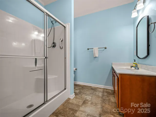 a bathroom with a shower and a sink