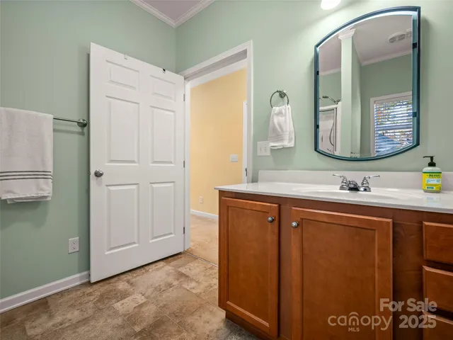 a bathroom with a sink a mirror and a shower