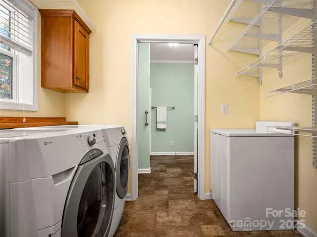 a utility room with dryer and washer