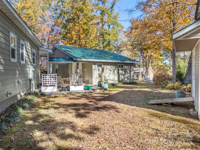 a front view of a house with basket ball court and outdoor seating
