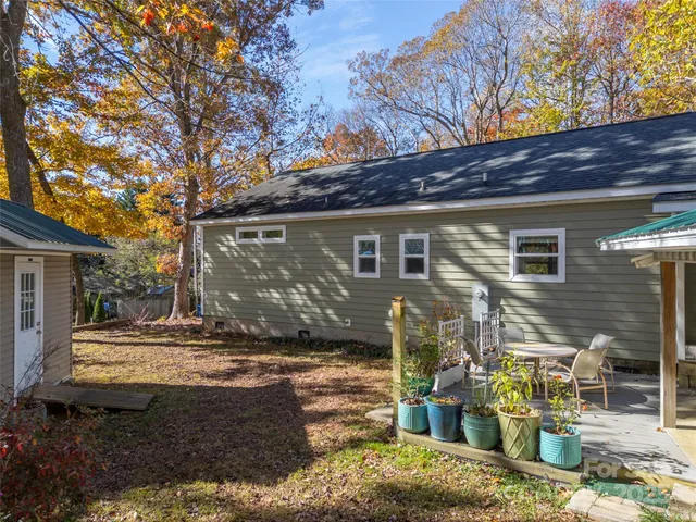 a view of a house with wooden fence