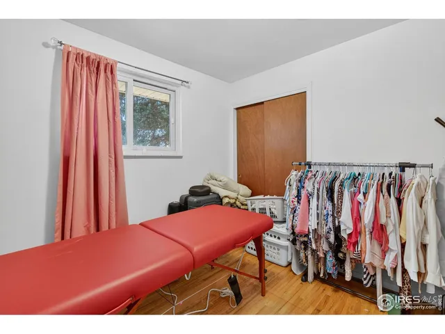 a bedroom with a bed and a closet