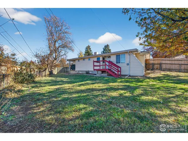 a view of a backyard with a small cabin