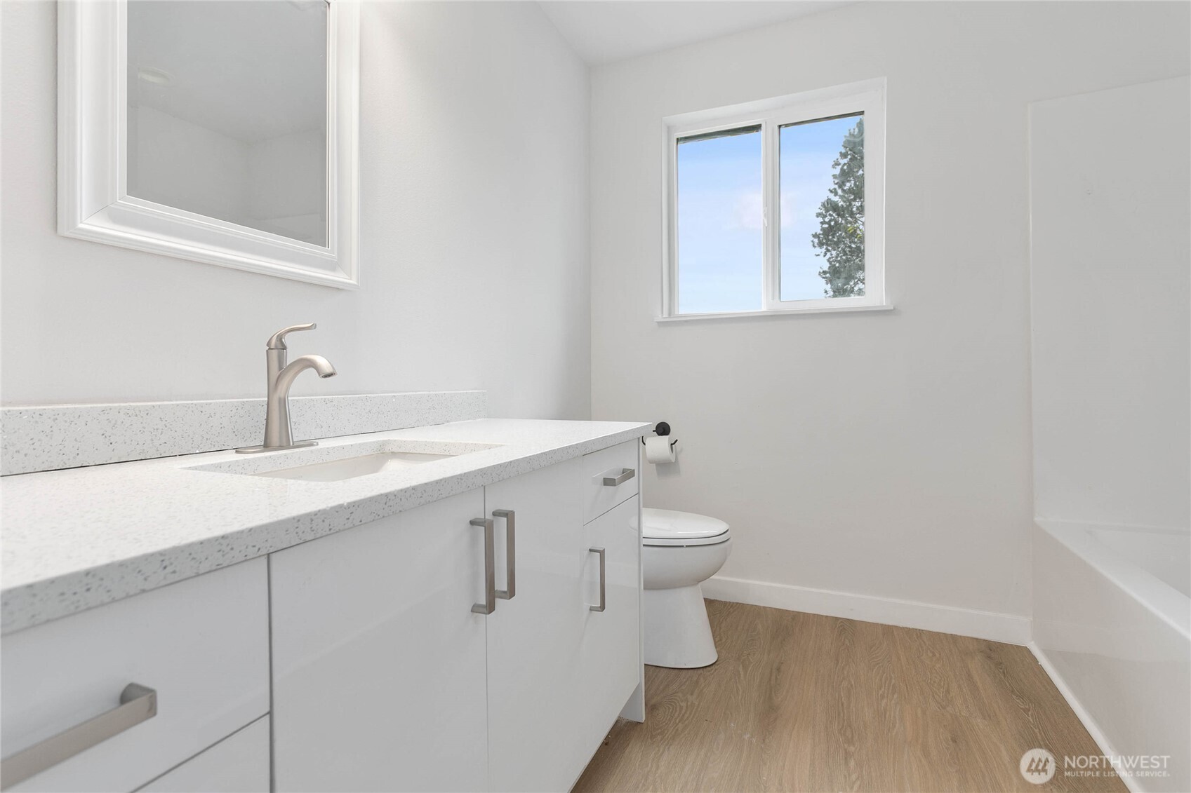 4656 Bay Road Blaine, WA 98230 - Photo 15 of 31 a bathroom with a toilet sink and mirror