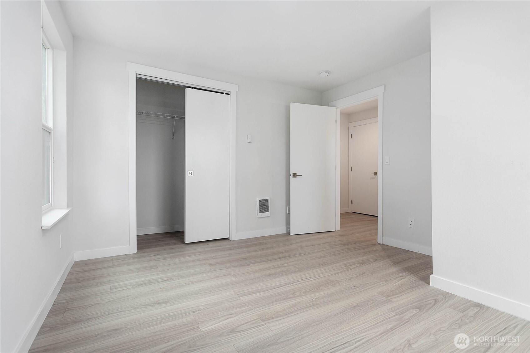 4656 Bay Road Blaine, WA 98230 - Photo 17 of 31 a view of an empty room with wooden floor and closet