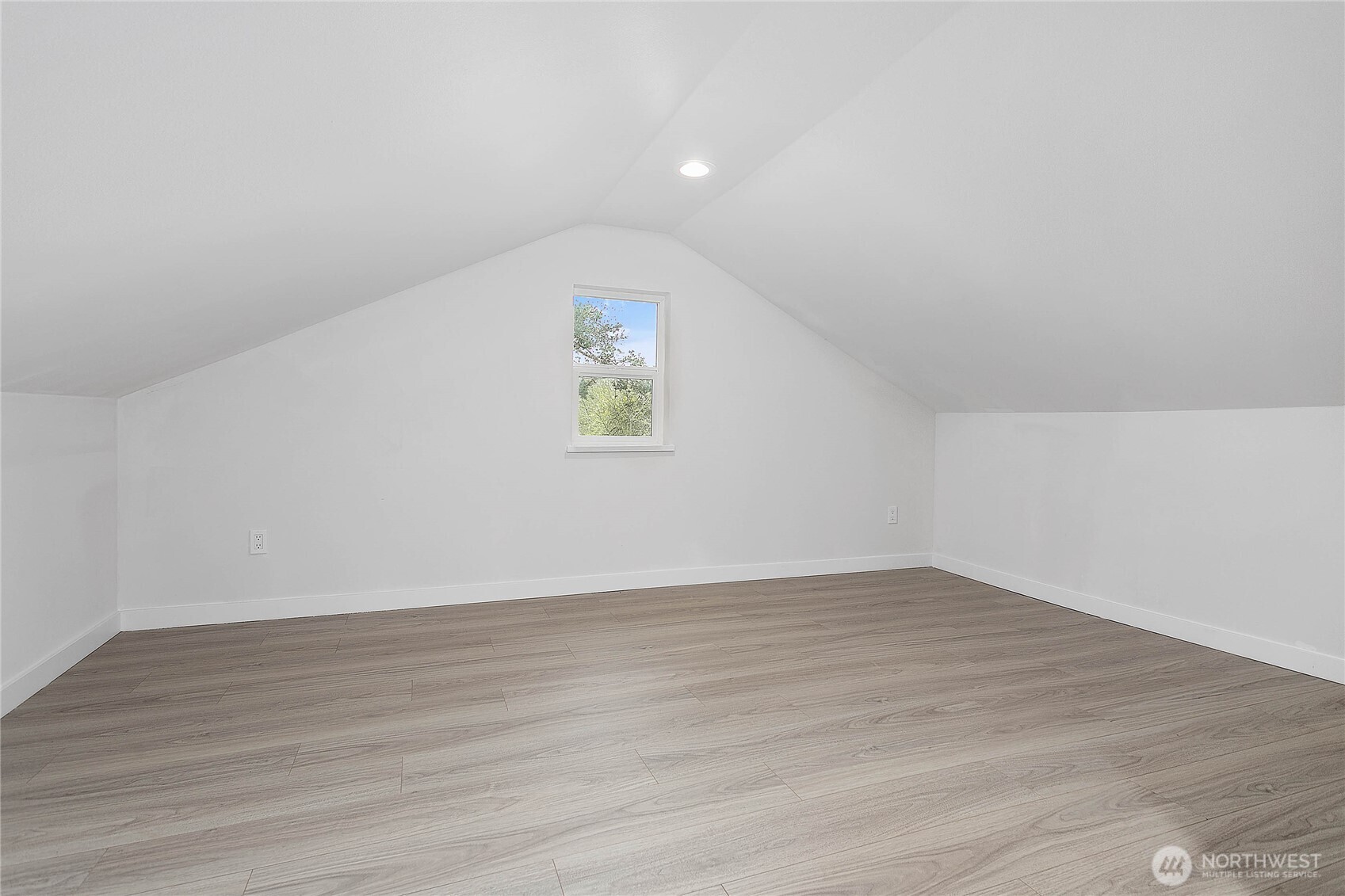 4656 Bay Road Blaine, WA 98230 - Photo 18 of 31 a view of an empty room with wooden floor and a window