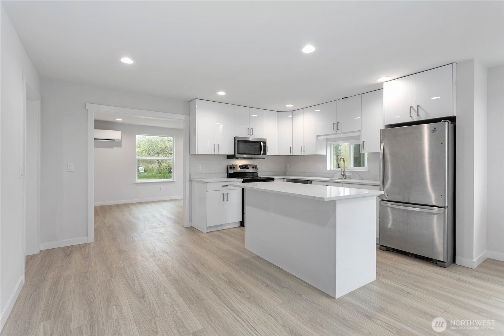 4656 Bay Road Blaine, WA 98230 - Photo 2 of 31 a kitchen with refrigerator cabinets and wooden floor